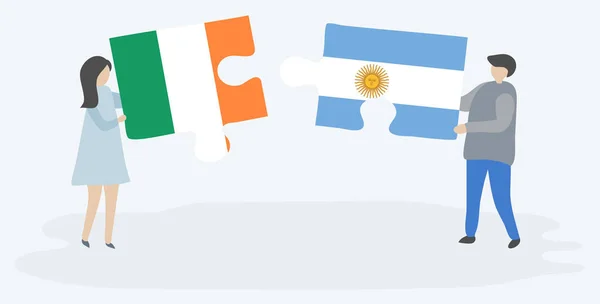 Para Trzyma Dwa Kawałki Puzzli Irlandzkich Argentyńskich Flag Symbole Narodowe — Wektor stockowy