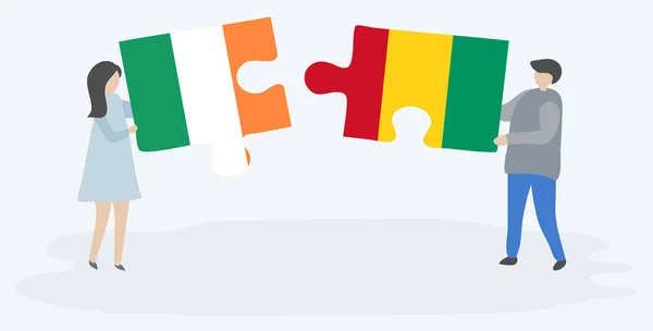 Casal Segurando Duas Peças Quebra Cabeças Com Bandeiras Irlandesas Guineenses —  Vetores de Stock