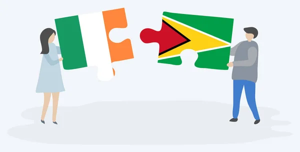 Couple Holding Two Puzzles Pieces Irish Guyanese Flags Ireland Guyana — Stock Vector