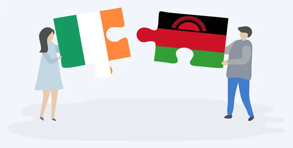 Para Trzyma Dwa Kawałki Puzzli Irlandzkich Malawian Flagi Symbole Narodowe — Wektor stockowy