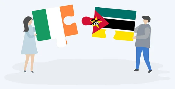 Couple Tenant Deux Pièces Puzzles Avec Irlandais Drapeaux Irlande Mozambique — Image vectorielle