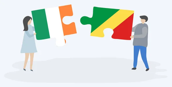 一对夫妇拿着两块拼图 上面挂着爱尔兰和刚果国旗 爱尔兰和刚果共和国国家象征在一起 — 图库矢量图片