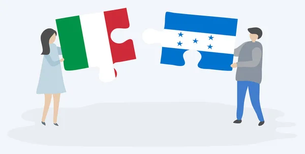 Para Trzyma Dwa Kawałki Puzzli Włoskich Honduran Flagi Włochy Honduras — Wektor stockowy