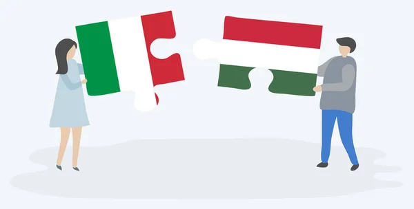 Pareja Sosteniendo Dos Piezas Rompecabezas Con Banderas Italianas Húngaras Italia — Vector de stock