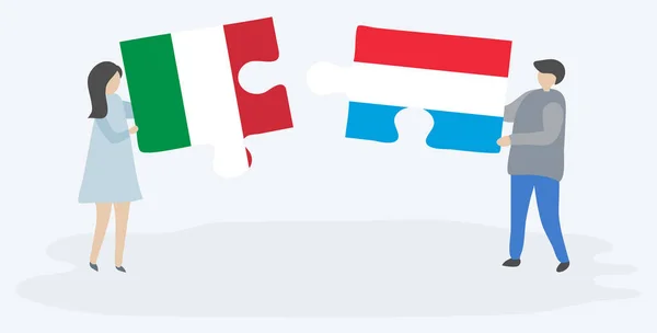 Paar Houden Twee Puzzels Stukken Met Italiaanse Luxemburgse Vlaggen Italië — Stockvector