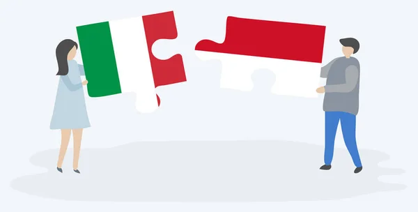 Para Trzyma Dwa Kawałki Puzzli Włoskich Monako Flagi Włochy Monako — Wektor stockowy