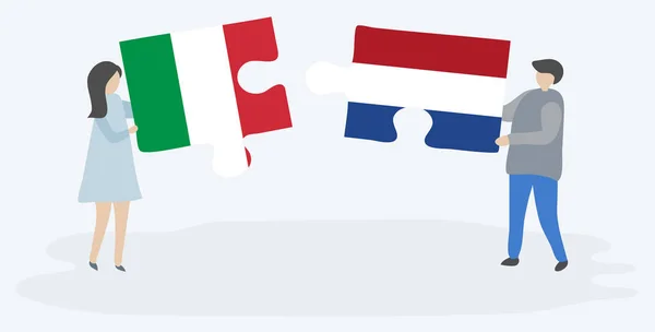 Ζευγάρι Που Κρατά Δύο Κομμάτια Παζλ Ιταλικές Και Ολλανδικές Σημαίες — Διανυσματικό Αρχείο
