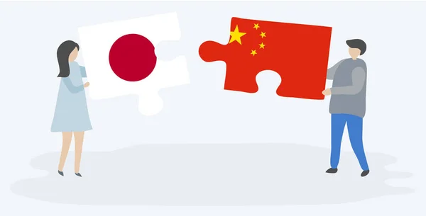 一对夫妇拿着两块带有日本和中国国旗的拼图 日中民族符号在一起 — 图库矢量图片