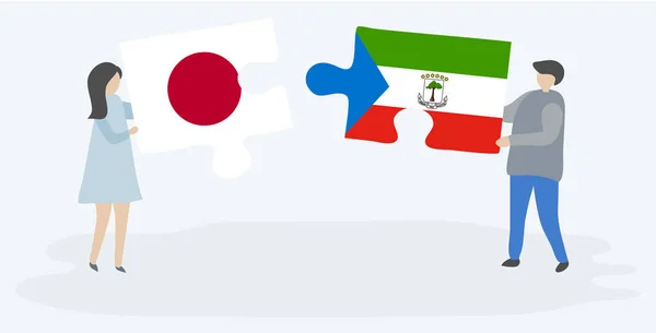 Пара Держащая Две Головоломки Японскими Экваториальными Гвинейскими Флагами Япония Экваториальная — стоковый вектор