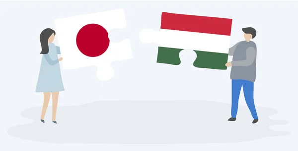 Pareja Sosteniendo Dos Piezas Rompecabezas Con Banderas Japonesas Húngaras Japón — Vector de stock