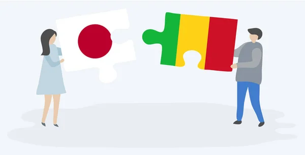 Japon Mali Bayrakları Ile Iki Bulmaca Parçaları Tutan Çift Japonya — Stok Vektör