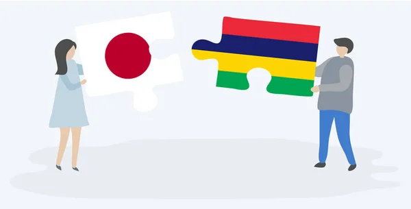 Pareja Sosteniendo Dos Piezas Rompecabezas Con Banderas Japonesas Mauricianas Japón — Vector de stock