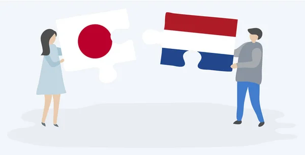 Dvojice Dvě Skládanky Japonskými Holandskou Vlajkou Japonské Nizozemské Národní Symboly — Stockový vektor