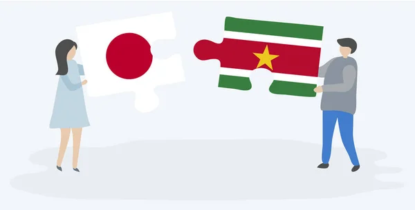 Ζευγάρι Που Κρατά Δύο Κομμάτια Παζλ Ιαπωνικές Και Σουρινάμ Σημαίες — Διανυσματικό Αρχείο