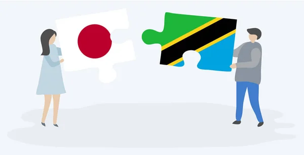 Pareja Sosteniendo Dos Piezas Rompecabezas Con Banderas Japonesas Tanzanas Japón — Vector de stock