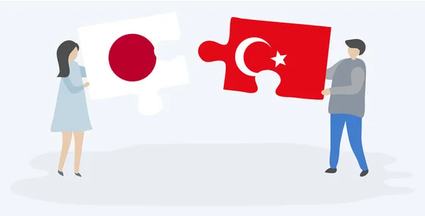 Japon Türk Bayrakları Ile Iki Bulmaca Parçaları Tutan Çift Japonya — Stok Vektör