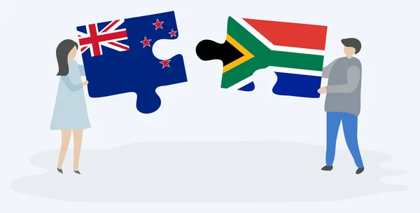 ニュージーランドと南アフリカの旗を持つ2つのパズルピースを保持しているカップル ニュージーランドと南アフリカの国のシンボル — ストックベクタ