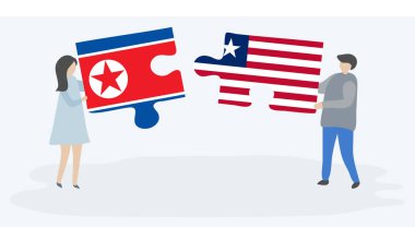 Kuzey Kore ve Liberya bayrakları ile iki bulmaca parçaları tutan çift. Kuzey Kore ve Liberya ulusal sembolleri birlikte.