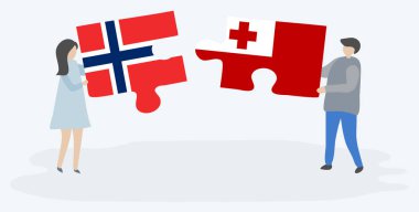 Couple holding two puzzles pieces with Norwegian and Tongan flags. Norway and Tonga national symbols together. clipart