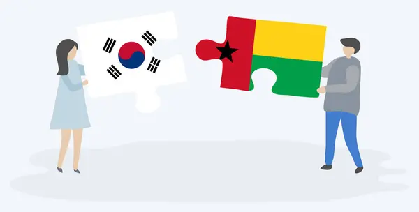 Para Trzymania Dwóch Puzzli Korei Południowej Bissau Gwinejczyk Flagi Symbole — Wektor stockowy