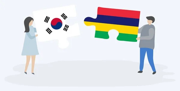 Para Trzyma Dwa Puzzle Kawałki Korei Południowej Mauritiusa Flagi Korea — Wektor stockowy