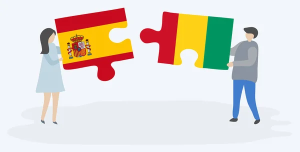Couple Holding Two Puzzles Pieces Spanish Guinean Flags Spain Guinea — Stock Vector