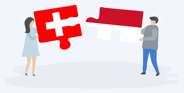 一对夫妇拿着两个拼图 上面挂着瑞士和摩纳哥国旗 瑞士和摩纳哥国家符号在一起 — 图库矢量图片