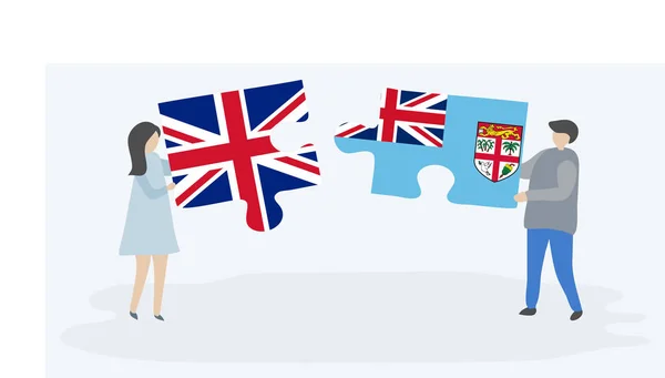 Pareja Sosteniendo Dos Piezas Rompecabezas Con Banderas Británicas Fiyianas Reino — Vector de stock