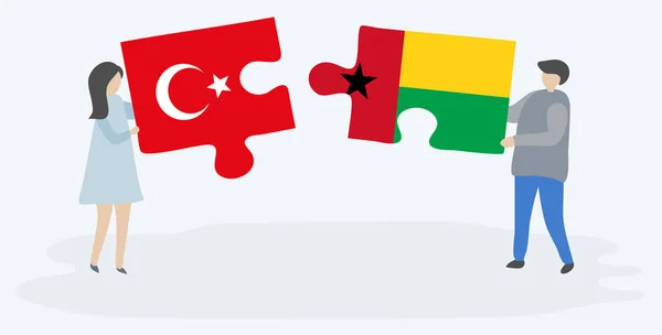 Paar Mit Zwei Puzzleteilen Mit Türkischen Und Bissau Guineischen Flaggen — Stockvektor