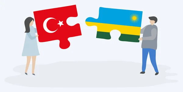 Türk Ruanda Bayrakları Ile Iki Bulmaca Parçaları Tutan Çift Türkiye — Stok Vektör