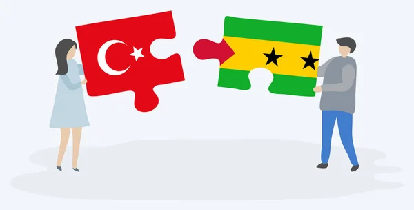 Türk Sao Tomean Bayrakları Ile Iki Bulmaca Parçaları Tutan Çift — Stok Vektör