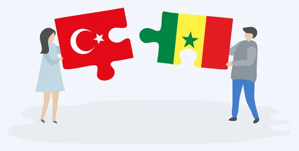 Türk Senegal Bayrakları Ile Iki Bulmaca Parçaları Tutan Çift Türkiye — Stok Vektör