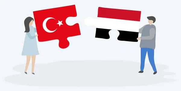 一对夫妇拿着两个拼图片 上面挂着土耳其和也门国旗 土耳其和也门国家符号在一起 — 图库矢量图片