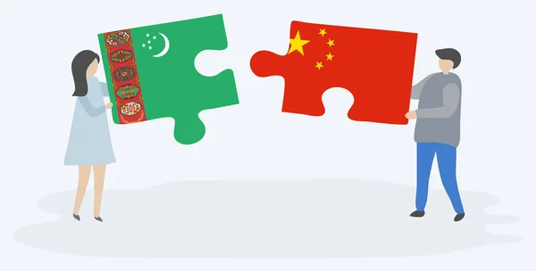 トルクメンと中国の旗を持つ2つのパズルピースを保持しているカップル トルクメニスタンと中国の国家シンボル — ストックベクタ