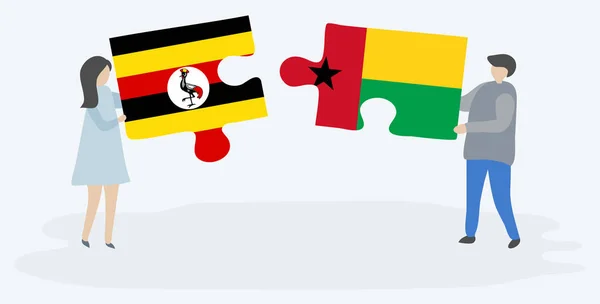 Uganda Bissau Gine Bayrakları Ile Iki Bulmaca Parçaları Tutan Çift — Stok Vektör