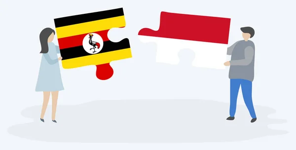 Para Trzyma Dwa Kawałki Puzzli Ugandy Indonezyjskie Flagi Uganda Indonezja — Wektor stockowy