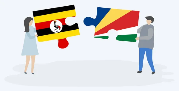 Para Trzyma Dwa Puzzle Kawałki Ugandy Seszellois Flagi Uganda Seszele — Wektor stockowy