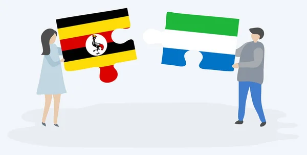Para Trzyma Dwa Kawałki Puzzli Ugandy Sierra Leonean Flagi Symbole — Wektor stockowy