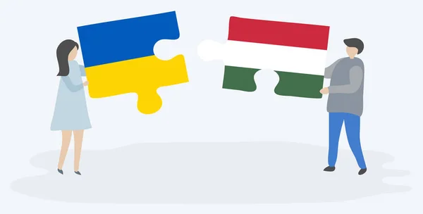 Cuplu Care Deține Două Piese Puzzle Uri Steaguri Ucrainene Maghiare — Vector de stoc