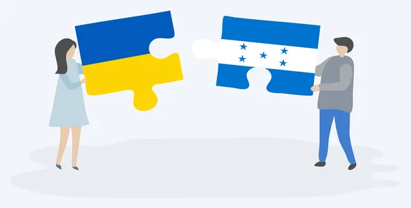 Couple Tenant Deux Pièces Puzzles Avec Des Drapeaux Ukrainiens Honduriens — Image vectorielle