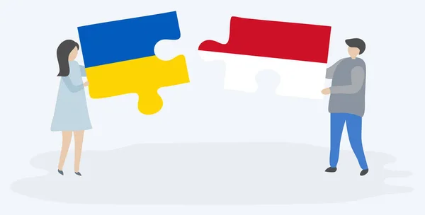 一对夫妇拿着两个拼图片与乌克兰和印度尼西亚国旗 乌克兰和印度尼西亚国家符号在一起 — 图库矢量图片