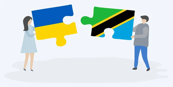Couple Holding Two Puzzles Pieces Ukrainian Tanzanian Flags Ukraine Tanzania — Stock Vector
