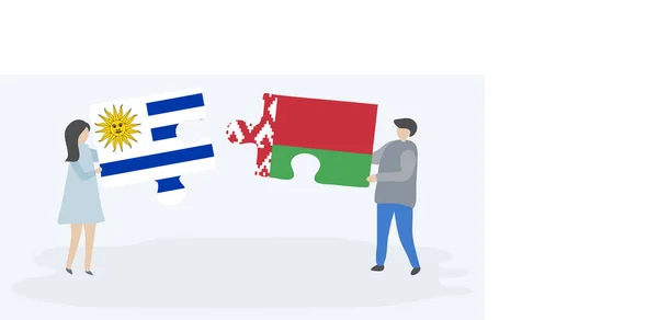 Пара Держащая Две Головоломки Уругвайскими Белорусскими Флагами Государственные Символы Уругвая — стоковый вектор