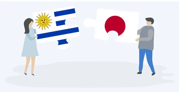 Para Trzyma Dwa Kawałki Puzzli Urugwajskim Japońskim Flagi Urugwaj Japonia — Wektor stockowy