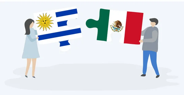 ウルグアイとメキシコの旗を持つ2つのパズルピースを保持しているカップル ウルグアイとメキシコの国のシンボル — ストックベクタ