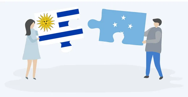 Para Trzyma Dwa Kawałki Puzzli Urugwajskim Mikronezyjskie Flagi Symbole Narodowe — Wektor stockowy