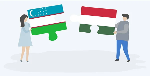 ウズベキスタンとハンガリーの旗を持つ2つのパズルのピースを保持しているカップル ウズベキスタンとハンガリーのシンボル — ストックベクタ