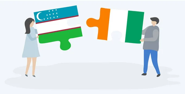 Paar Mit Zwei Puzzleteilen Mit Usbekischen Und Ivorischen Flaggen Usbekistan — Stockvektor