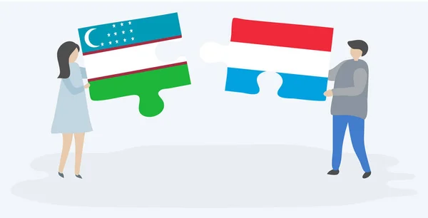 一对夫妇拿着两块拼图 上面挂着乌兹别克和卢森堡国旗 乌兹别克斯坦和卢森堡国家符号在一起 — 图库矢量图片