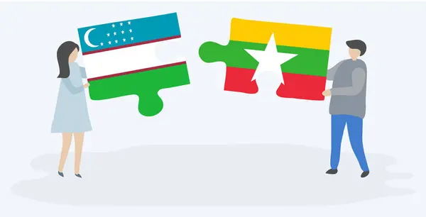 ウズベキスタンとビルマの旗を持つ2つのパズルピースを保持しているカップル ウズベキスタンとミャンマーの国のシンボル — ストックベクタ